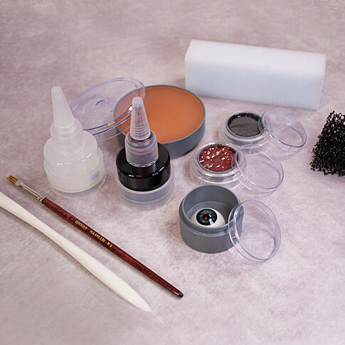 grimas-derma-wax-realistische-special-effects-wax Dermawax spatula, Artificial eye 301, disposable make-up sponges, dermawax 60ml, multi remover 25ml, stoppelsponge, Filmblood D 25ml, water make-up pure 101 &504, R4 Brush